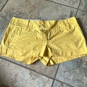 Hurley size 3 yellow with thin white stripe shorts. Zip up with 2 hooks